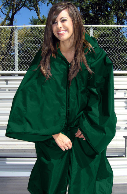 Woman standing on bleachers zipping the lower portion of a green Ultimate SportsWrap