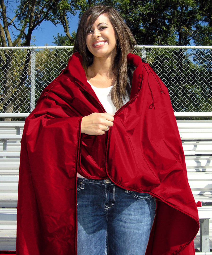 Red Ultimate SportsWrap on woman zipping top zipper.