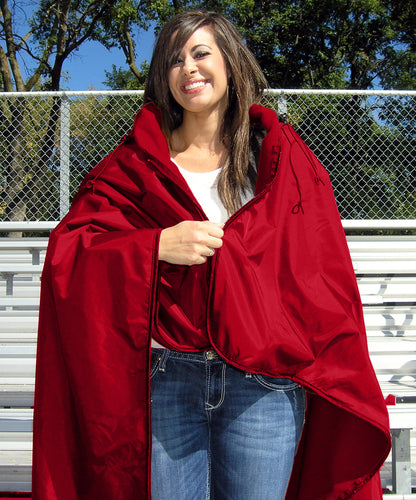 Red Ultimate SportsWrap on woman zipping top zipper.